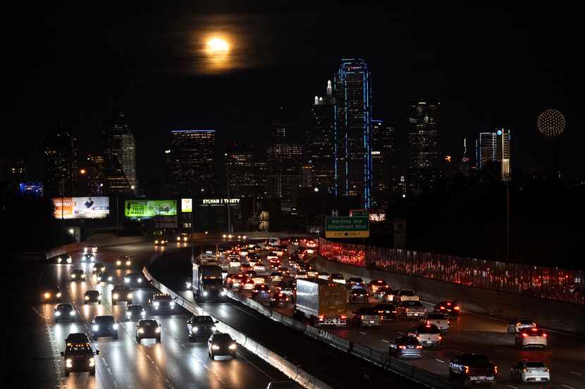 The Dallas skyline  as commuters roll along Interstate 30 in November 2023. (AP Photo/Julio...
