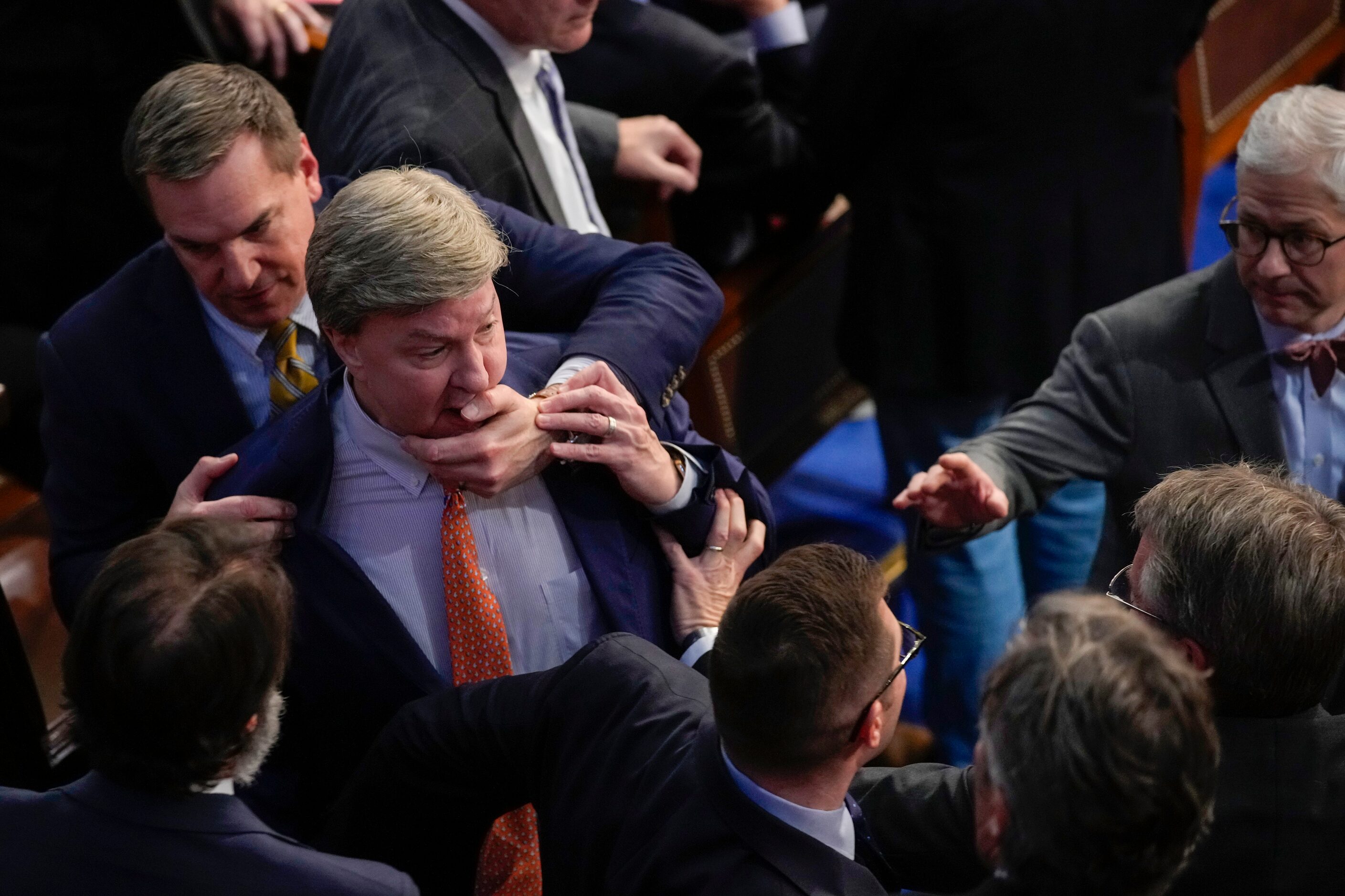 Rep. Richard Hudson, R-N.C., left, pulls Rep. Mike Rogers, R-Ala., back as they talk with...