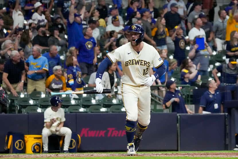 Milwaukee Brewers' Rhys Hoskins reacts after hitting a grand slam during the sixth inning of...