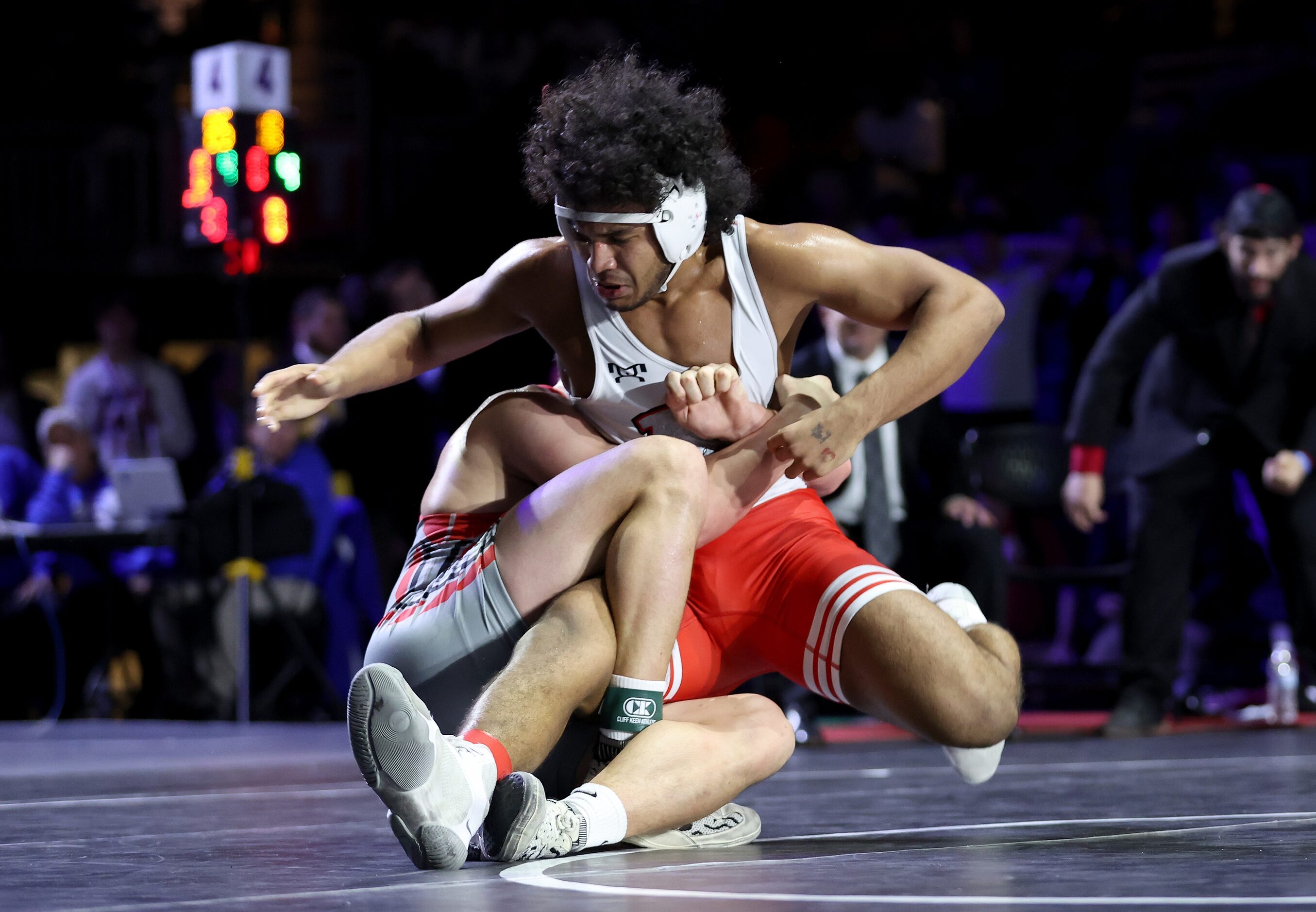 Ibraheem Ahmed of Arlington Martin (red) competes against Rocco Grazier of Houston Bellaire...