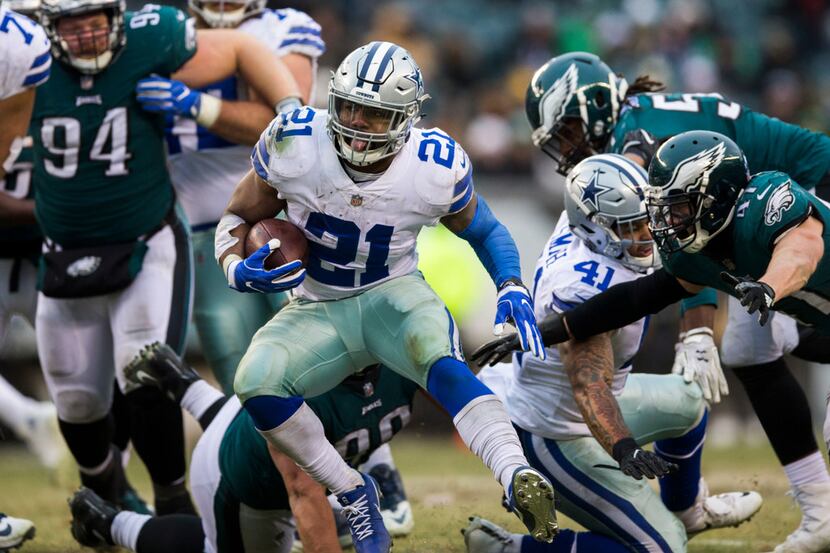 Dallas Cowboys running back Ezekiel Elliott (21) runs the ball during the fourth quarter of...