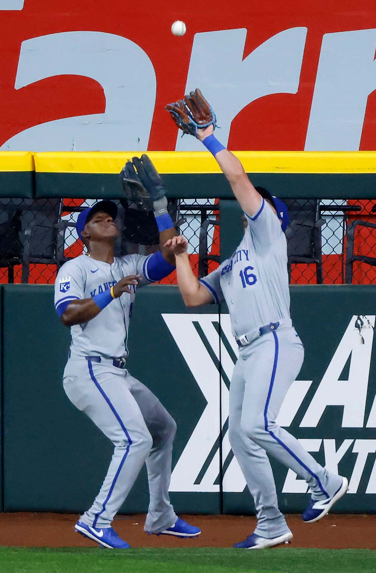 Kansas City Royals outfielders Hunter Renfroe (16) and Dairon Blanco (44) nearly collide as...