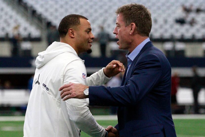 Dallas Cowboys quarterback Dak Prescott (4) greets former Dallas Cowboys QB Troy Aikman...