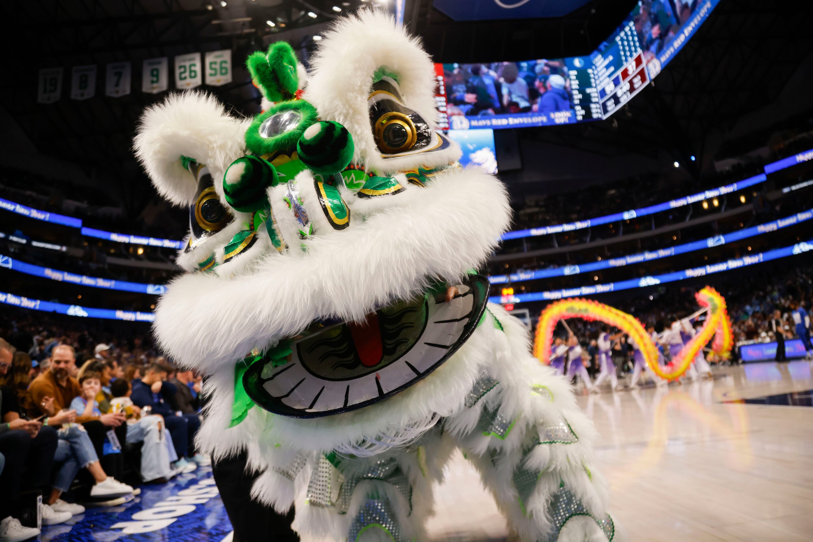 Lion dancers with JL Sports Association perform during a Lunar New Year celebration during...