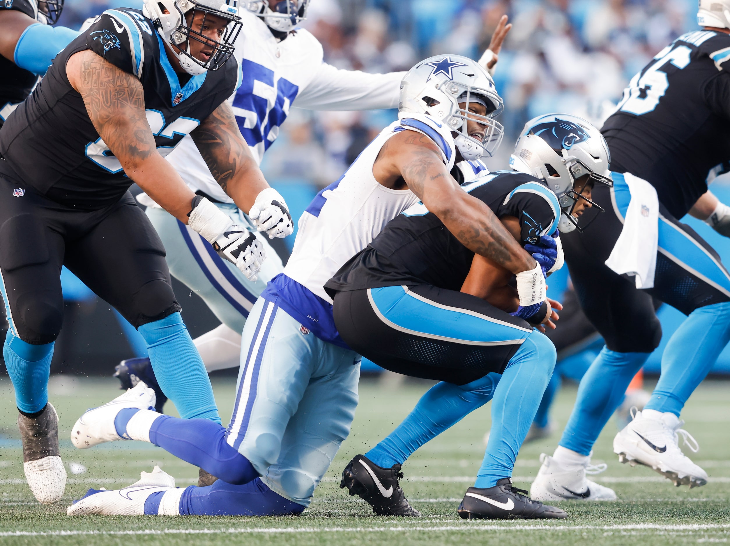 Dallas Cowboys defensive end Sam Williams (54) sacks Carolina Panthers quarterback Bryce...