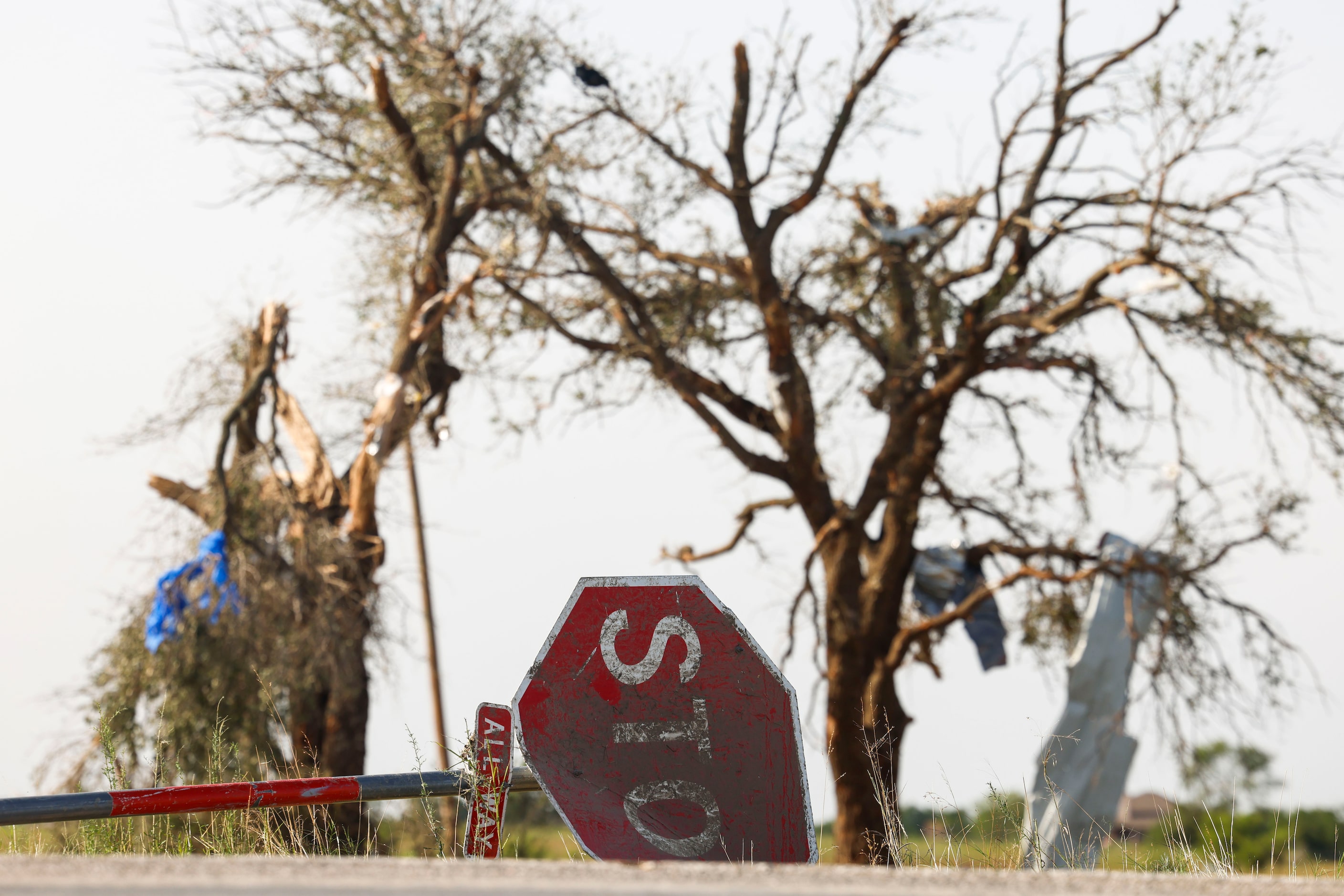 Damaged road signs by a Shell gas station, on Sunday, May 26, 2024, in Valley View, after a...