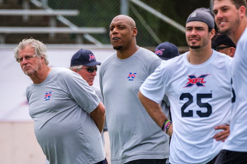 Dallas XF offensive coordinator Hal Mumme (left) watches a 7-on-7 drill during tryouts for...