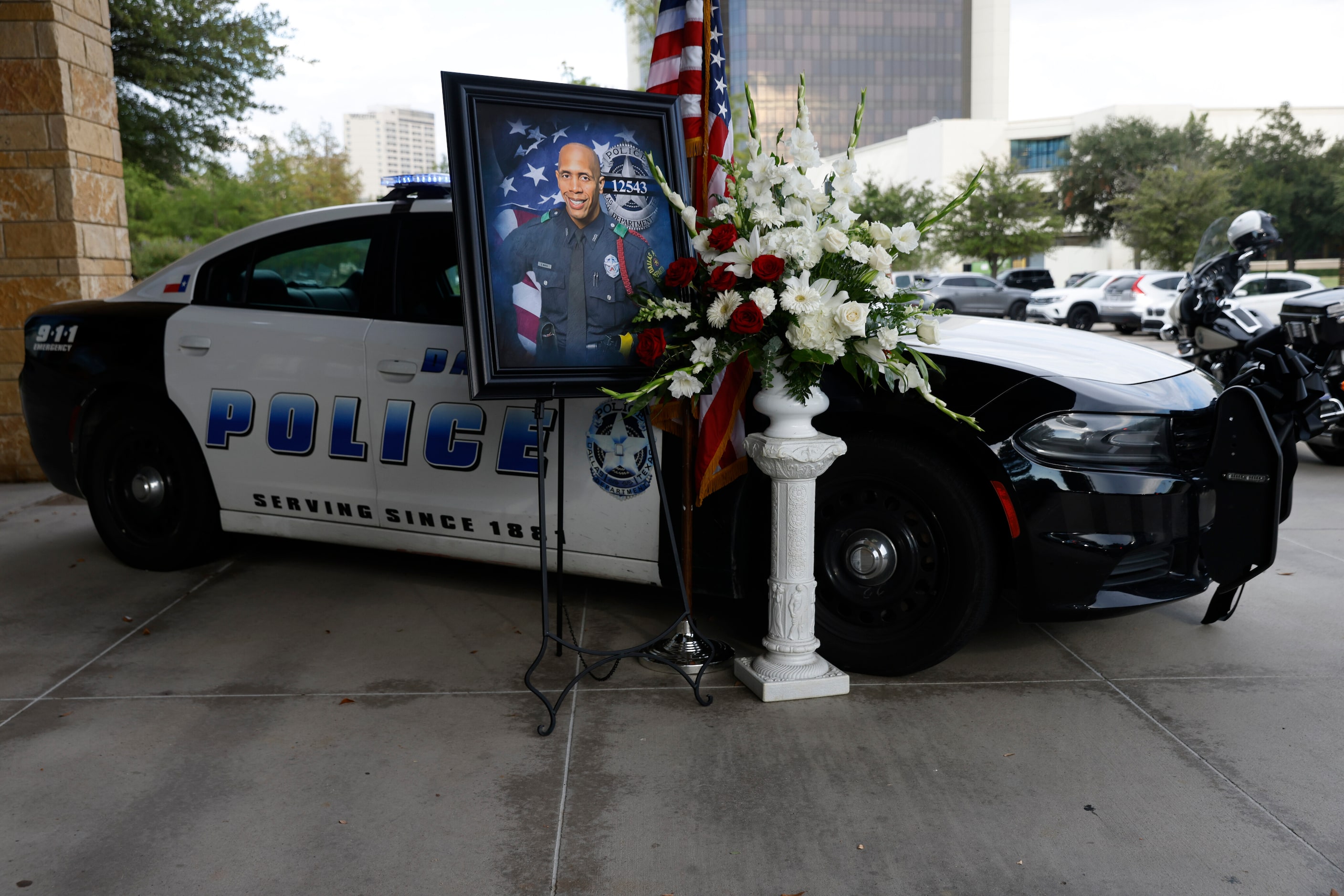 A memorial for Dallas police Officer Darron Burks is seen outside of Watermark Community...