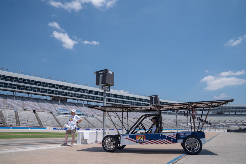 Harmony Public School students prepare to test their solar-powered vehicle on the track.