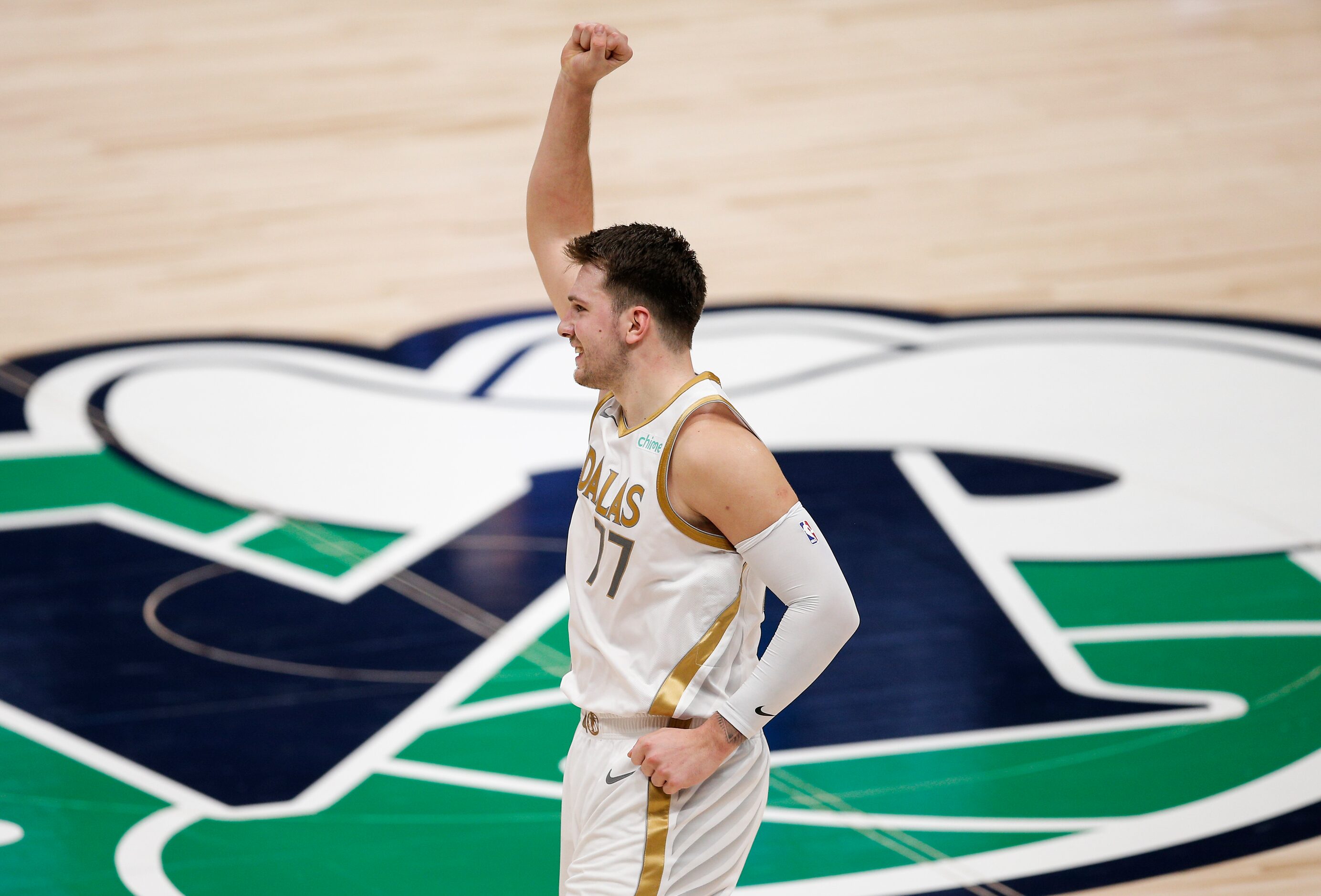 Dallas Mavericks guard Luka Doncic (77) celebrates a three-point shot during the second half...