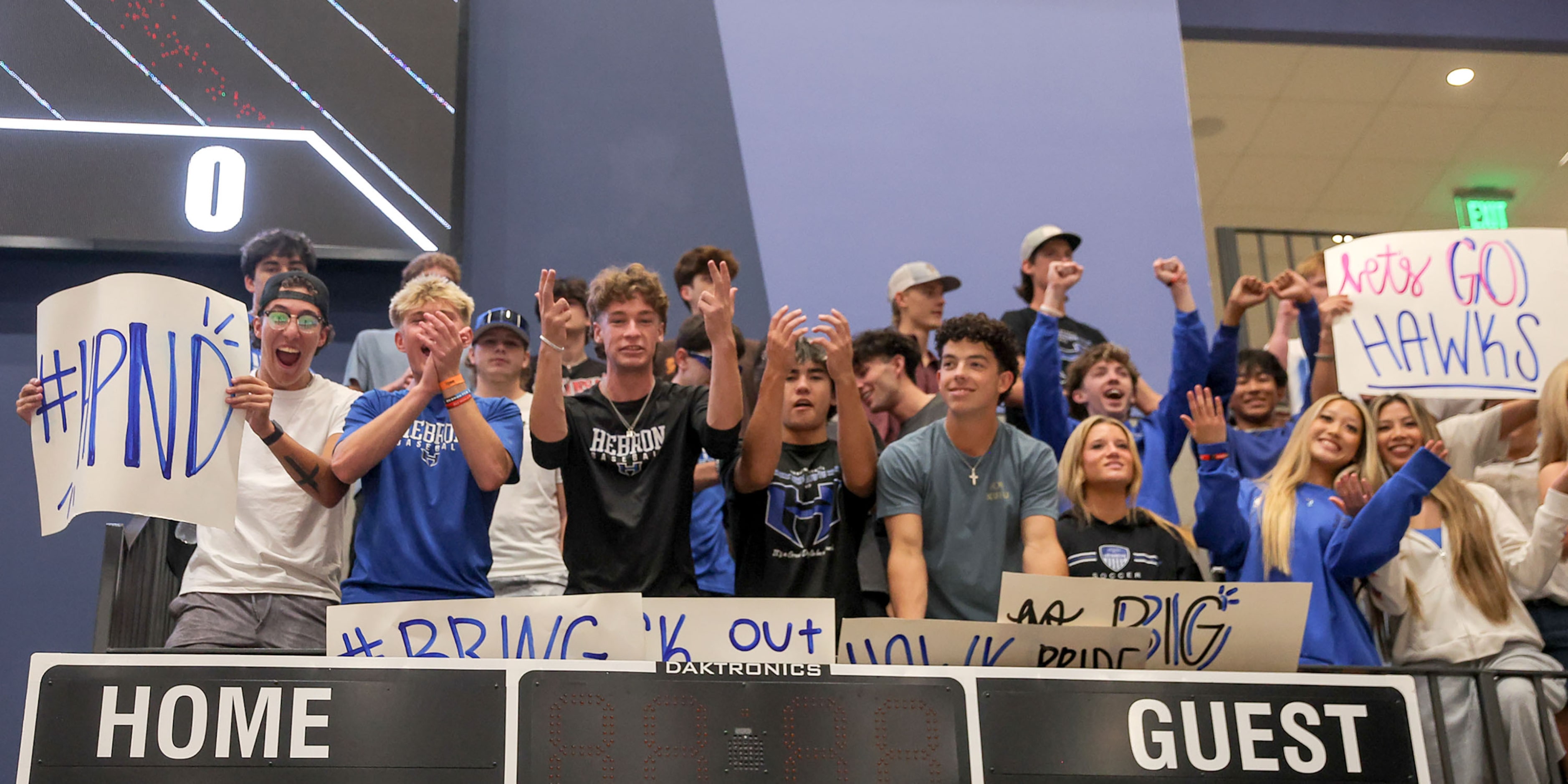 The Hebron students cheer on their Lady Hawks against Southlake Carroll in a Class 6A...