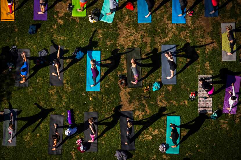 The Dallas Yoga Center hosts a yoga class at Kylde Warren Park