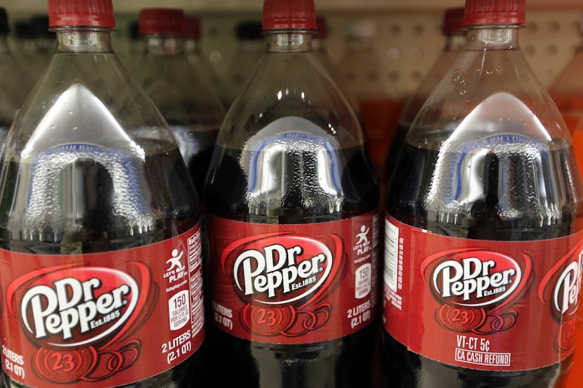 FILE - This Thursday, April 28, 2016, file photo shows bottles of Dr. Pepper on a store...