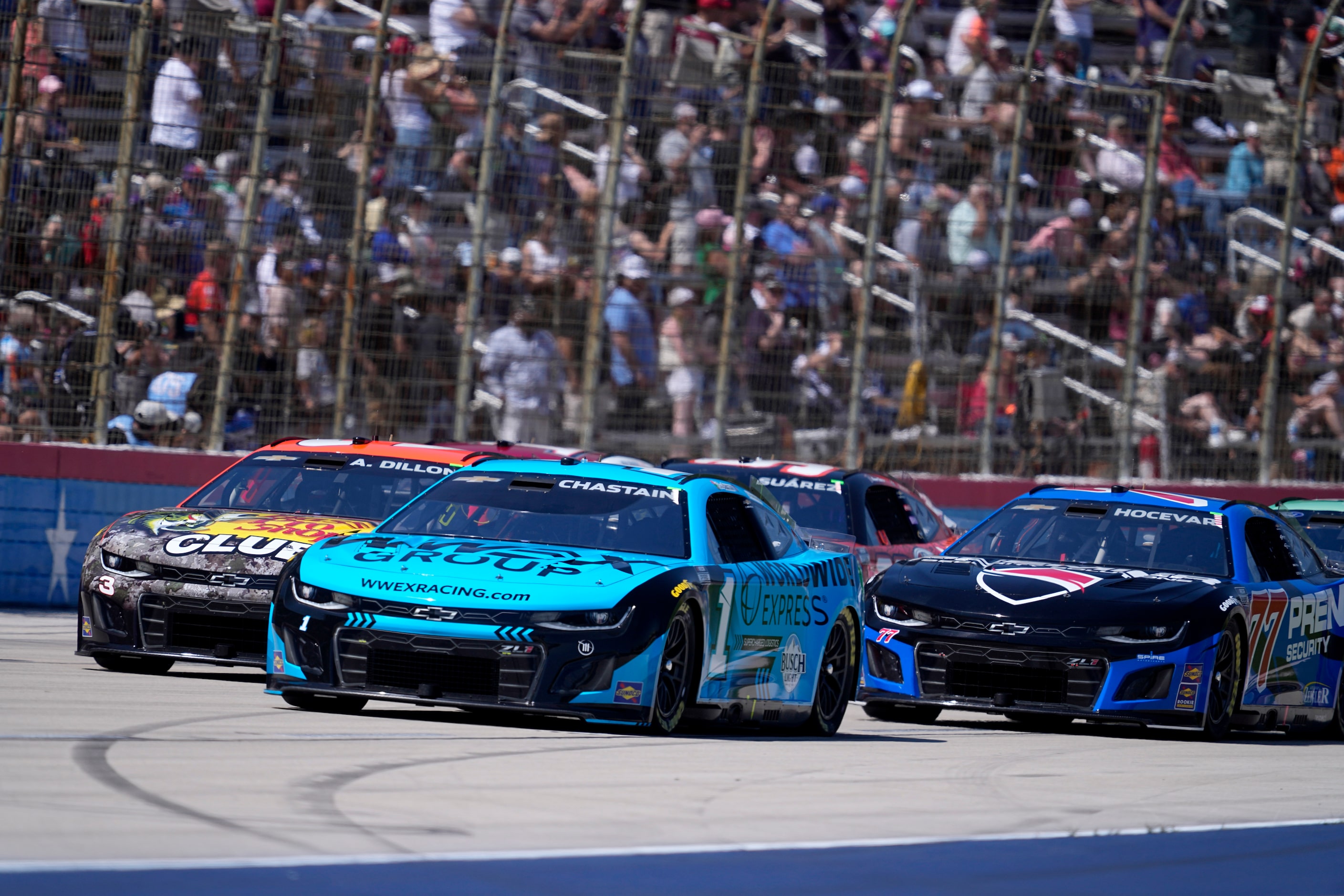 Ross Chastain (1), Austin Dillon (3) and Carson Hocevar (77) head into Turn 4 during a...