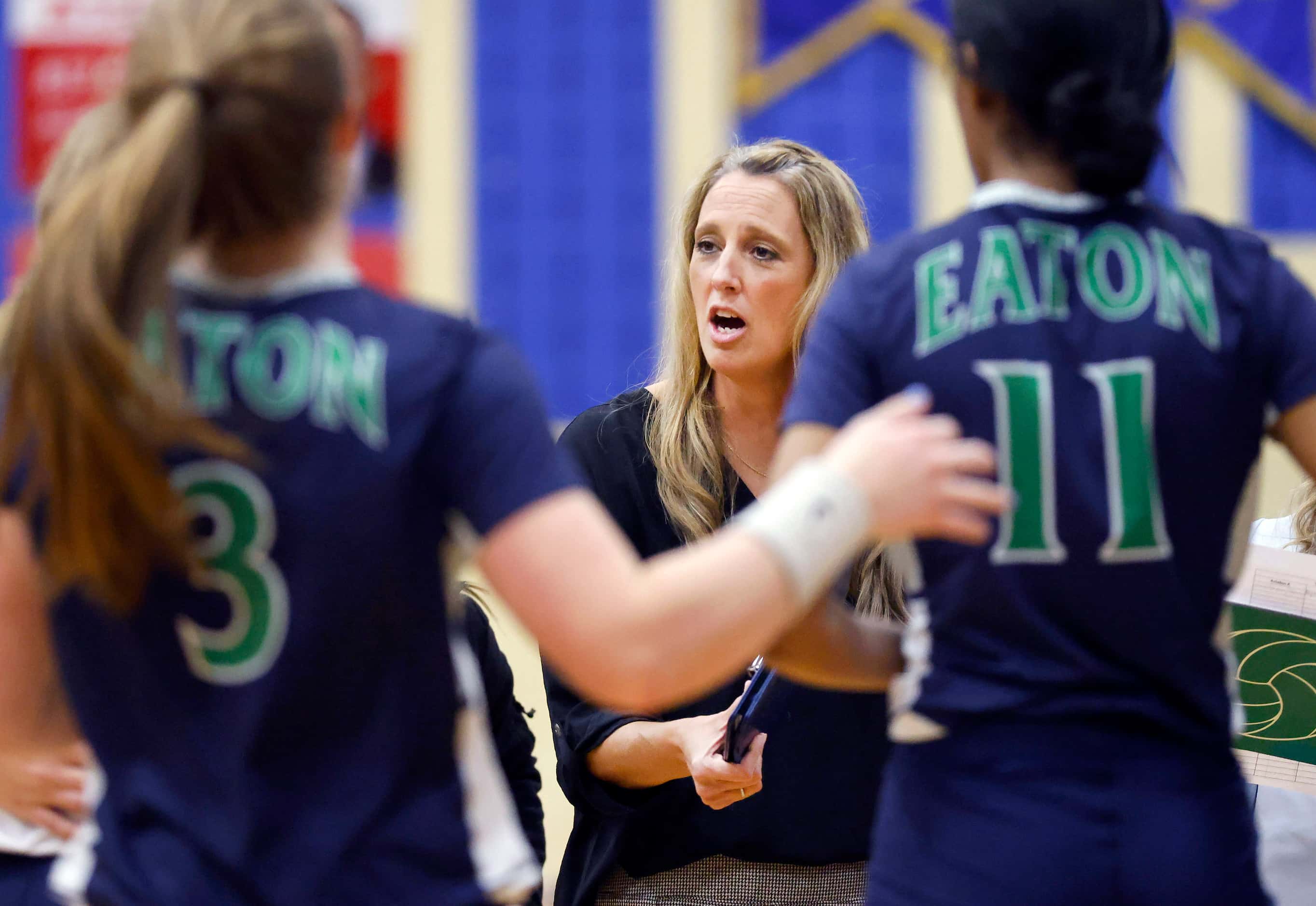 Eaton High head coach Leslie Berens delivers instruction to her team during their volleyball...