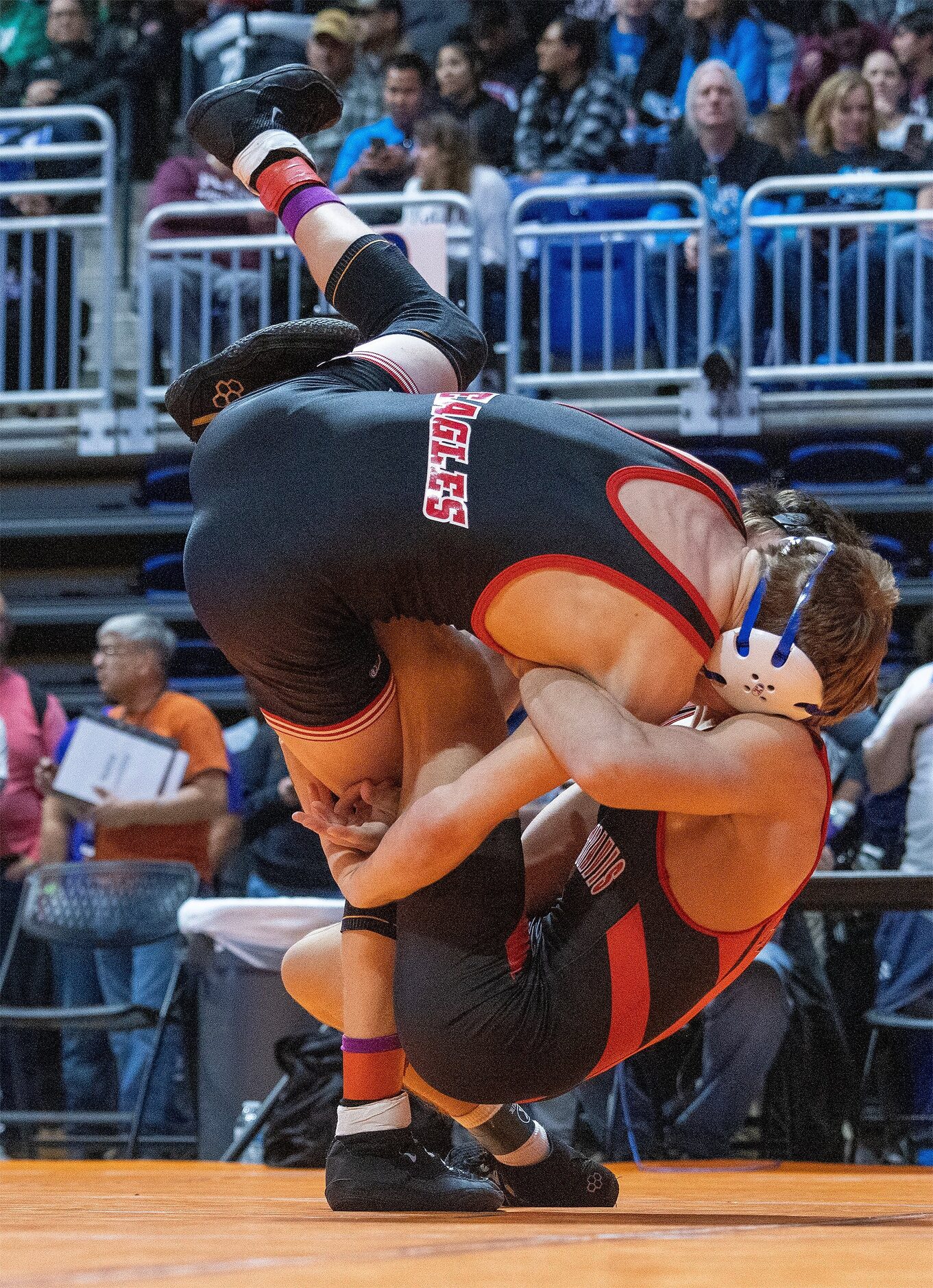 Joseph Liescheski from Allen (top) wrestles Will Deutschlander from Austin Lake Travis in...