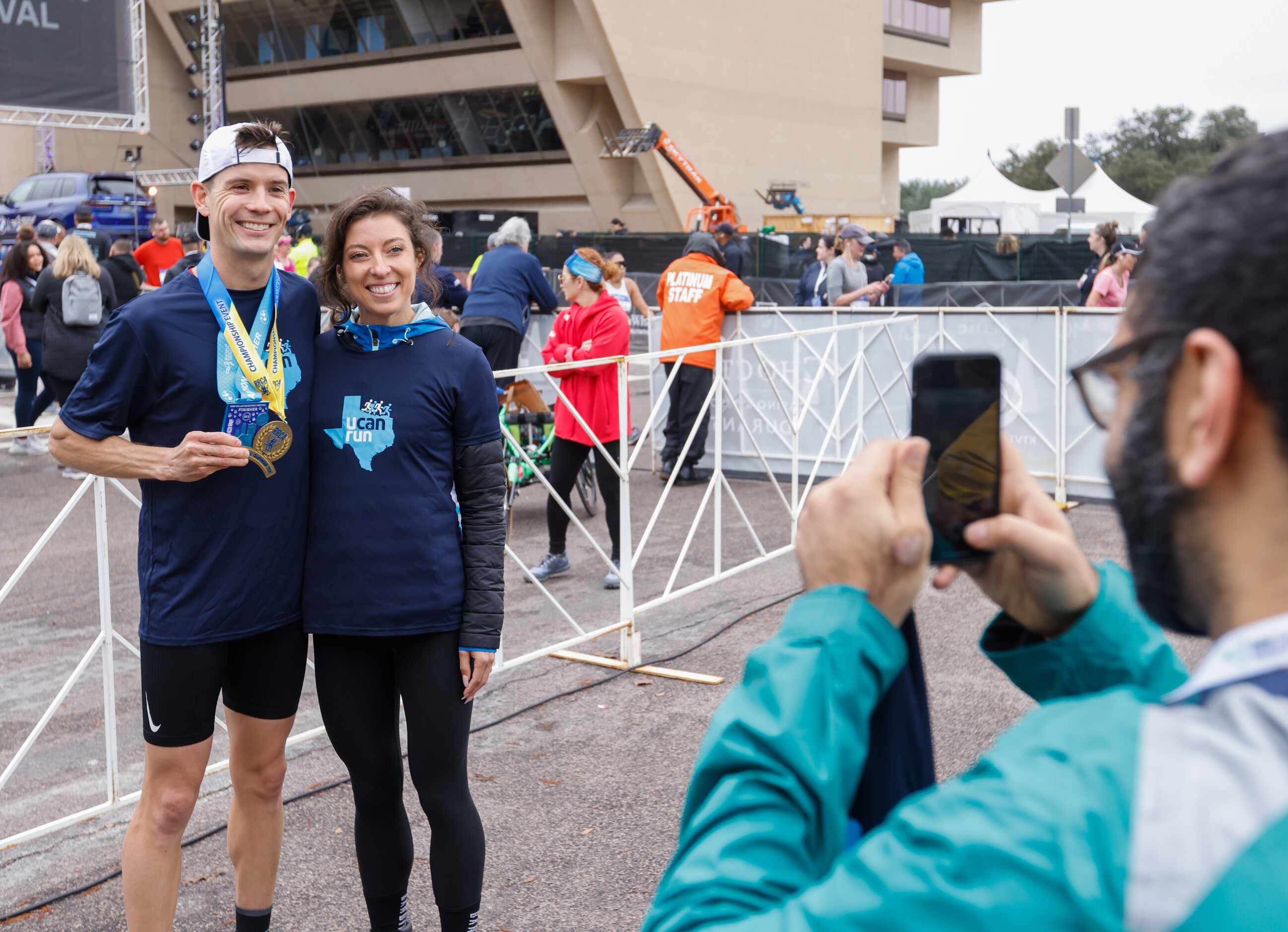 Cameron Beckett (left), winner of the full marathon, poses with American athlete Emma Bates,...