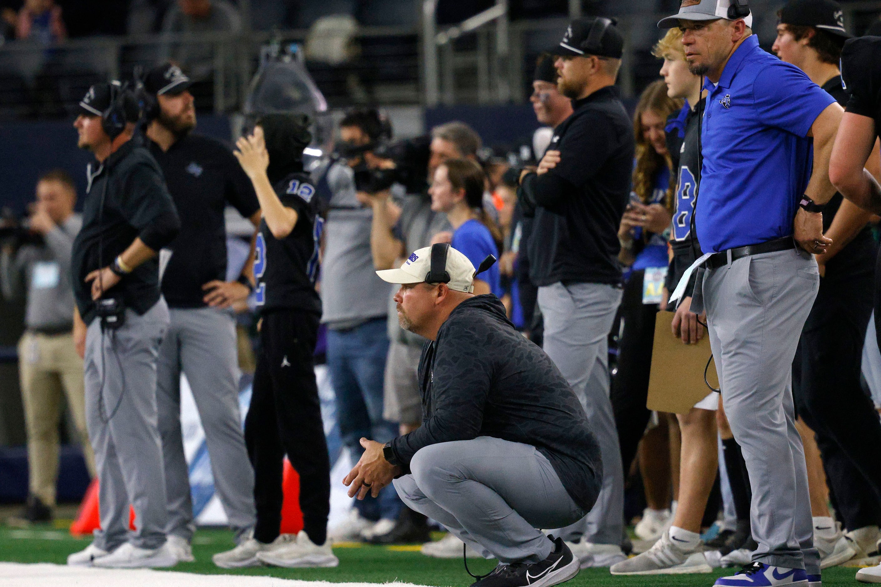 Gunter's head coach Jake Fieszel watches his p layers in the second half of the Class 3A...