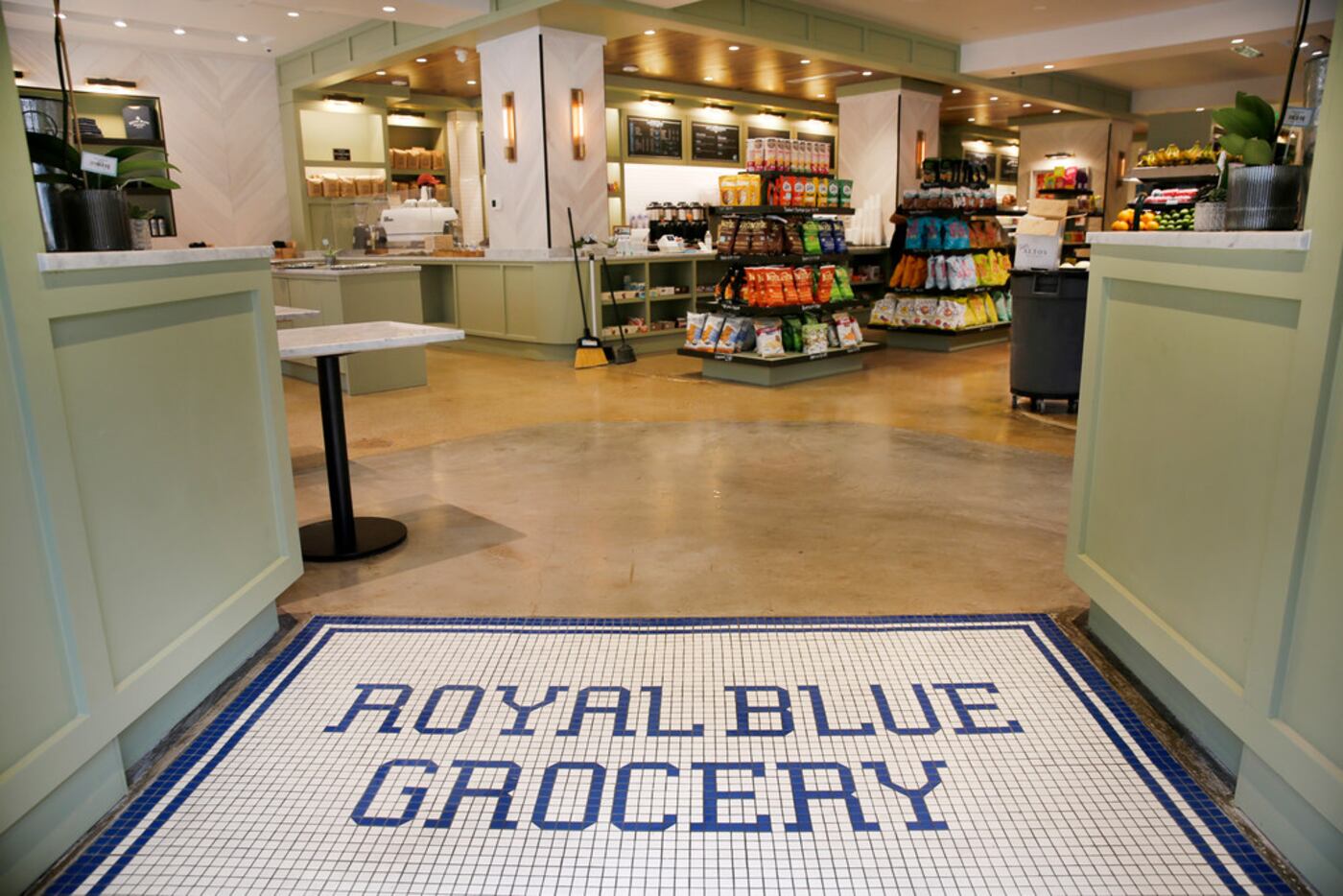 The Royal Blue Grocery tile entryway welcomes shoppers and diners to it's new store at Main...