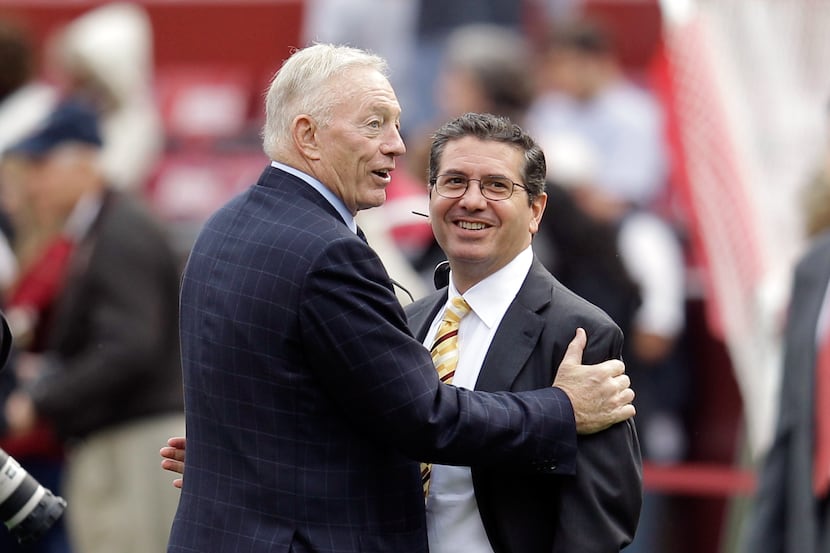 Dallas Cowboys owner Jerry Jones (left) talks with Washington Redskins owner Daniel Snyder...