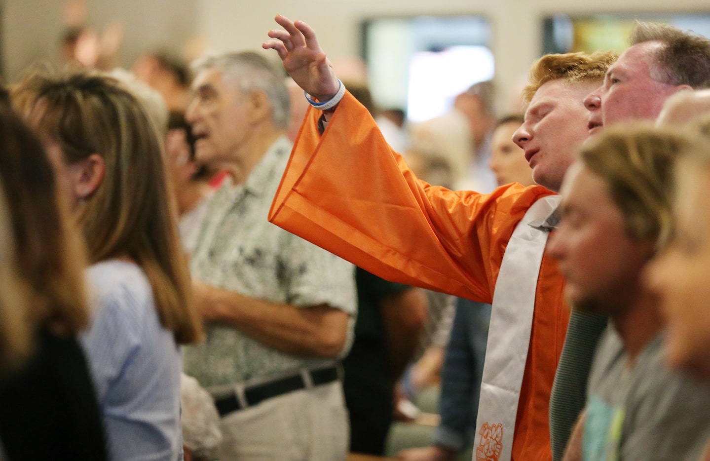 After being recognized with other graduating high school seniors, a student worships during...