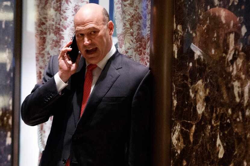 In this Nov. 29, 2016 photo, Goldman Sachs COO Gary Cohn talks on his phone as he waits for...