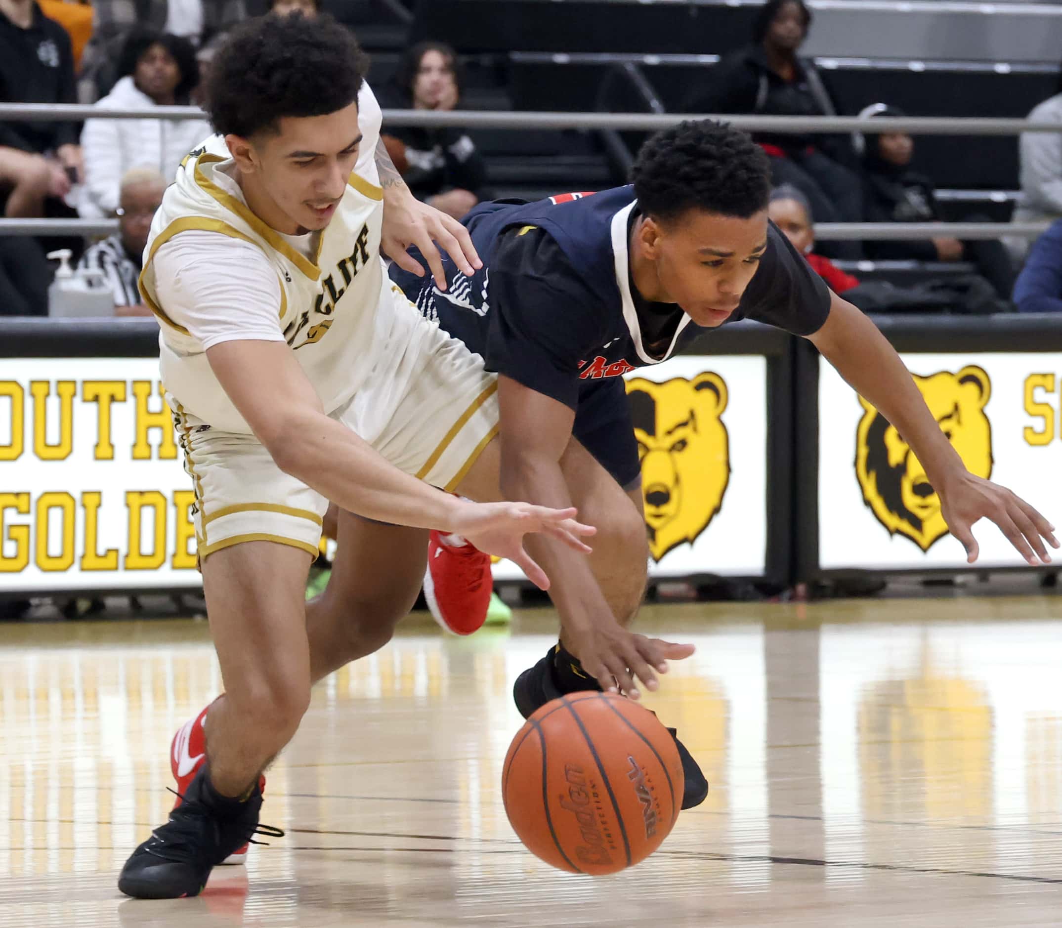South Oak Cliff's Preston Pacheco-Morgan (5), left, and Kimball's Kayden Gray (0) battle for...