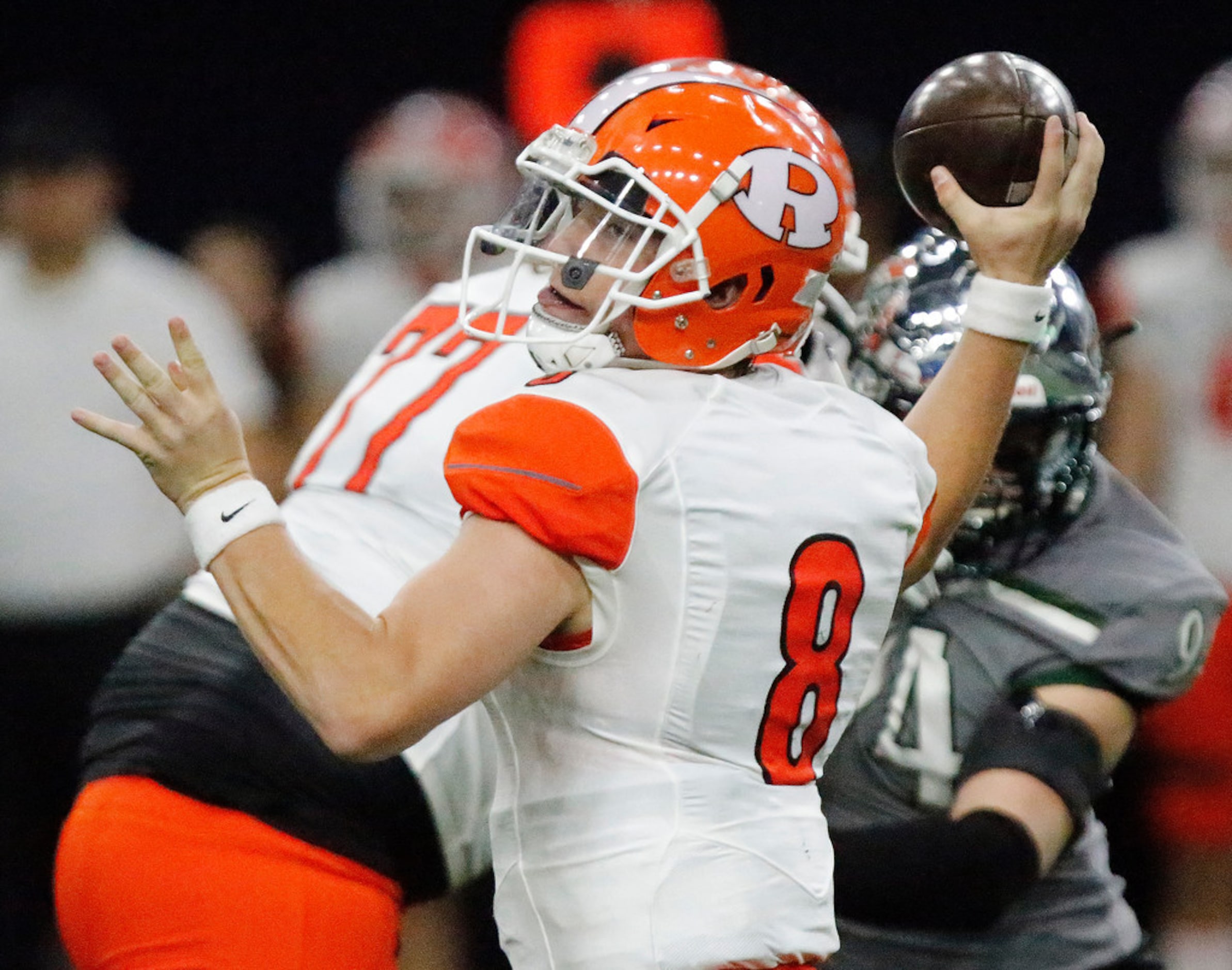 Rockwall High School quarterback Braedyn Locke (8) has his first pass intercepted and...