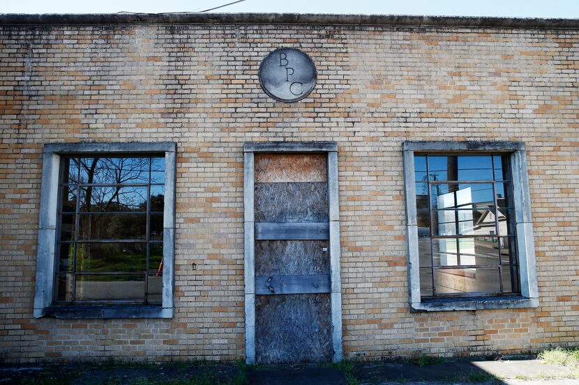 The Bama Pie Co. building remains boarded up in places.