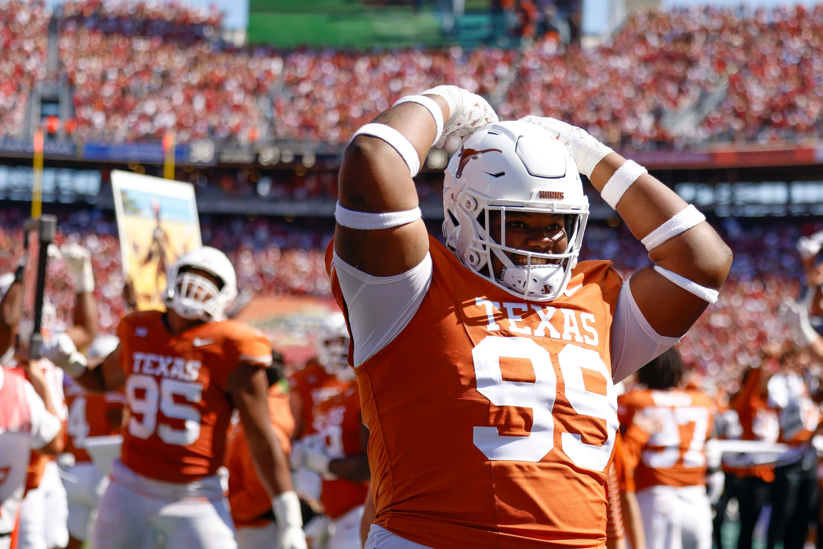 Texas defensive lineman Sydir Mitchell hype up the crowd during the second half of Red River...
