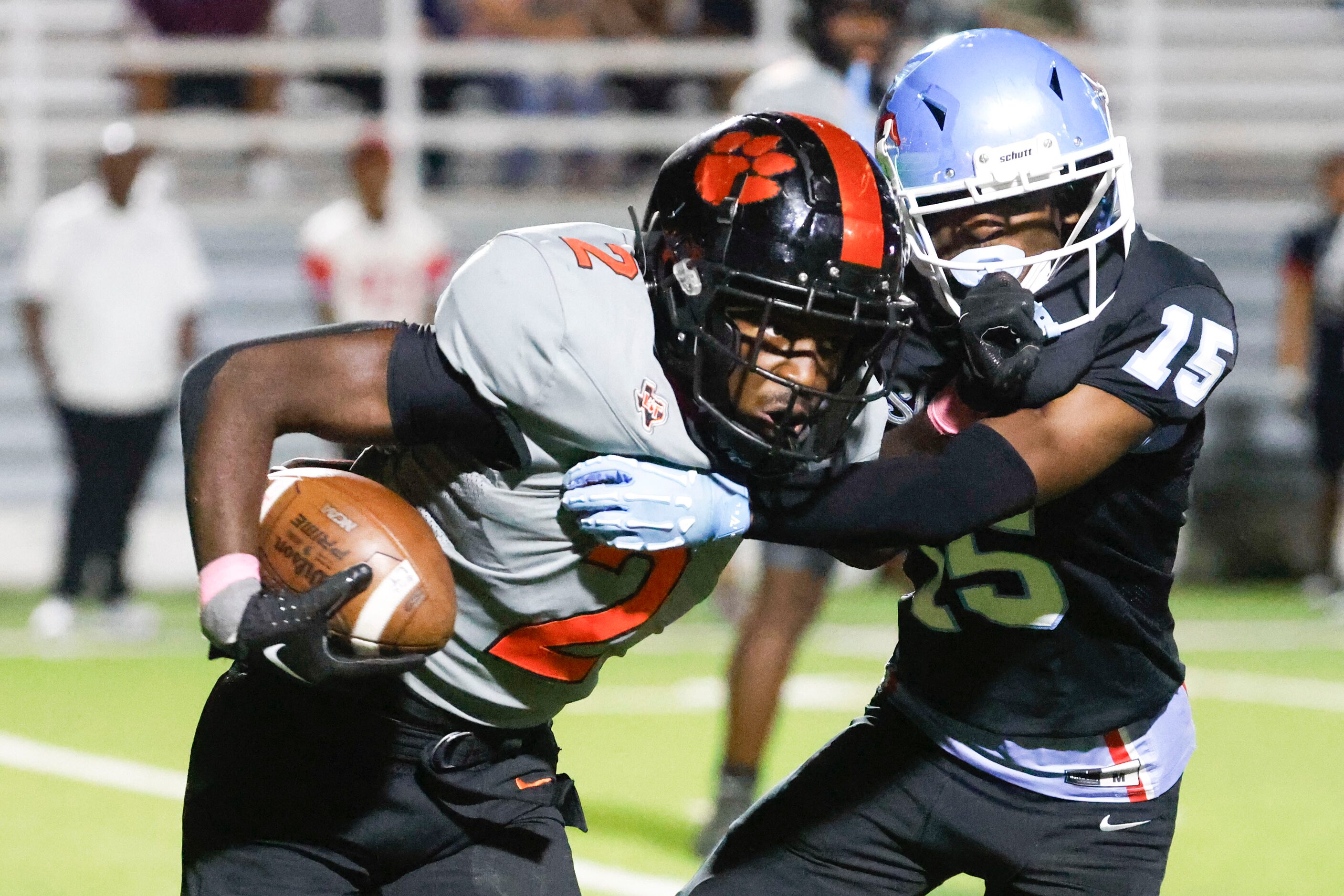 Lancaster High’s Izayah Lee (left) runs against Skyline High’s William Davis during the...