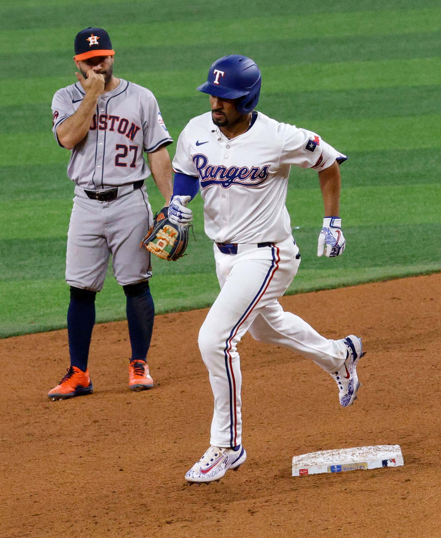 Texas Rangers second base Marcus Semien (2) runs the bases after hitting a home run as...