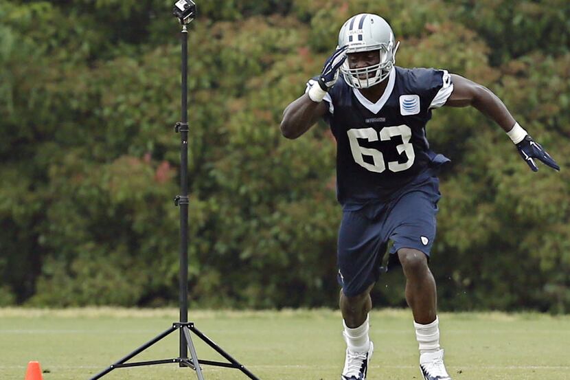 Dallas Cowboys tight end Efe Obada runs past a GoPro camera during a minicamp for rookie...