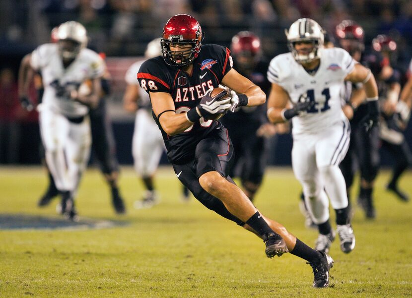 SAN DIEGO, CA - DECEMBER 20: Gavin Escobar #88 of the San Diego State Aztecs runs with the...