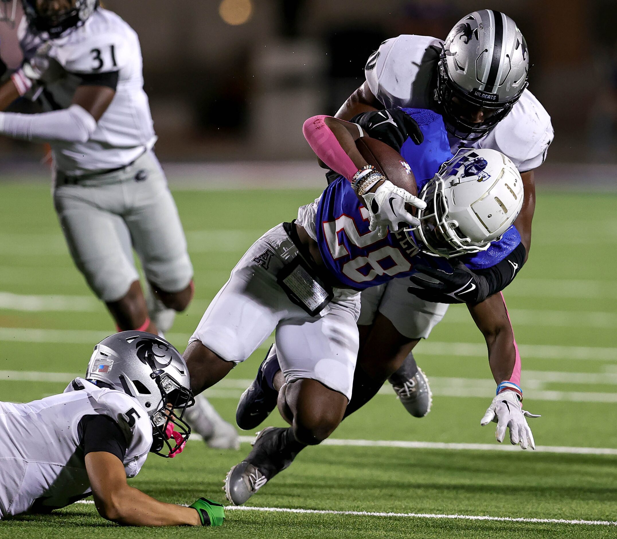 Allen running back Amir McDowell (28) fights for yardage against Denton Guyer linebacker...