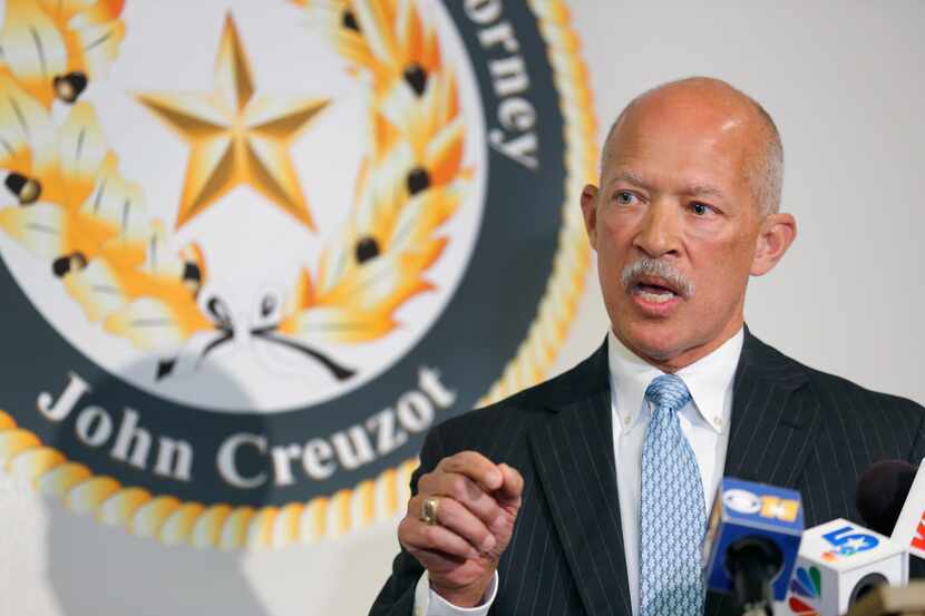 File image of Dallas County District Attorney John Creuzot speaking during a press...