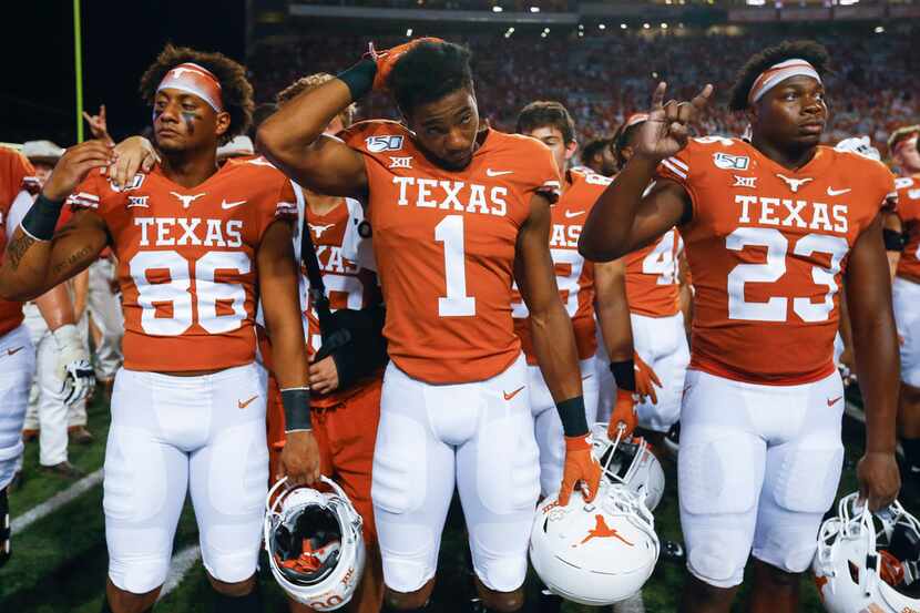 Texas Longhorns wide receiver Jordan Pouncey (86), wide receiver John Burt (1) and...