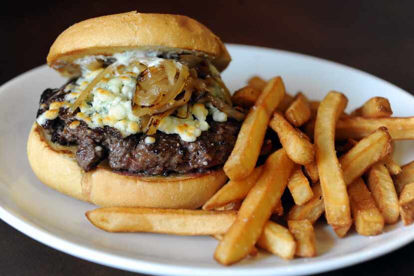 The West Plano Burger at Pinstack features gorgonzola, roasted garlic aioli, and caramelized...