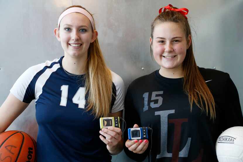Flower Mound's Lauren Cox (left) and Lovejoy's Sarah Langs hold their insulin pump as they...