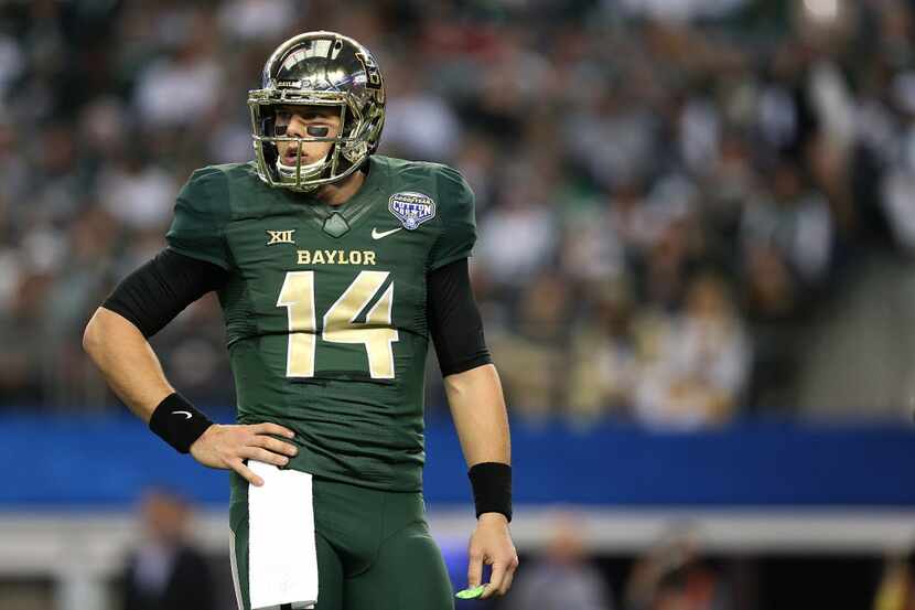 ARLINGTON, TX - JANUARY 01: Bryce Petty #14 of the Baylor Bears looks on during the Goodyear...