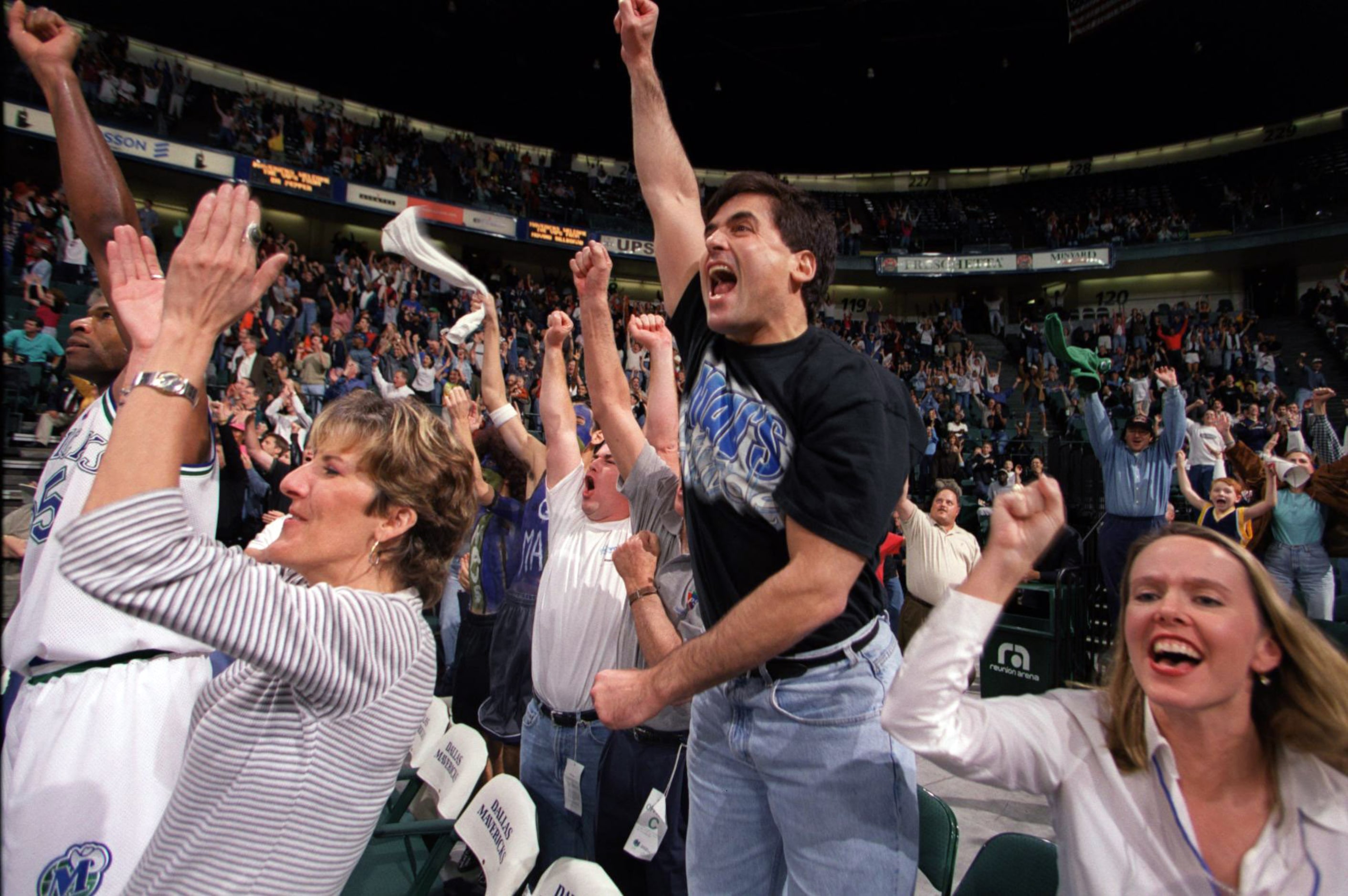 October 20, 2000: Dallas Mavericks owner Mark Cuban jumps for joy during a preseason game...