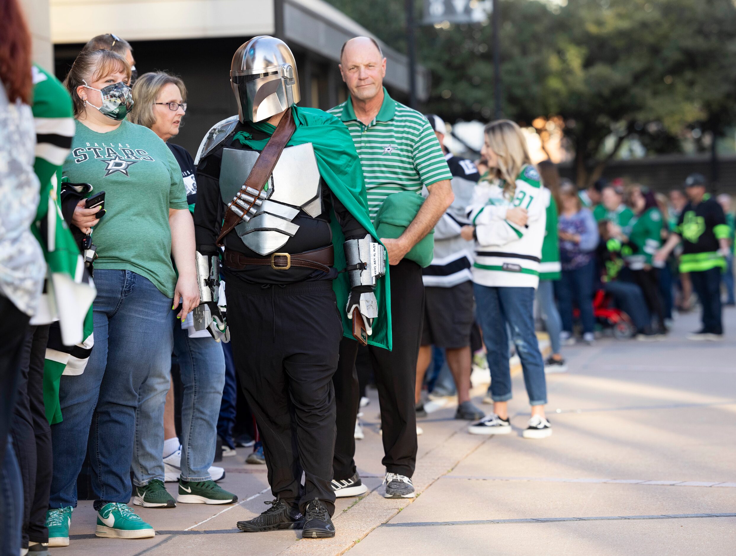 Matt Day (in helmet) waits in line before the start of Dallas Stars home opener against the...