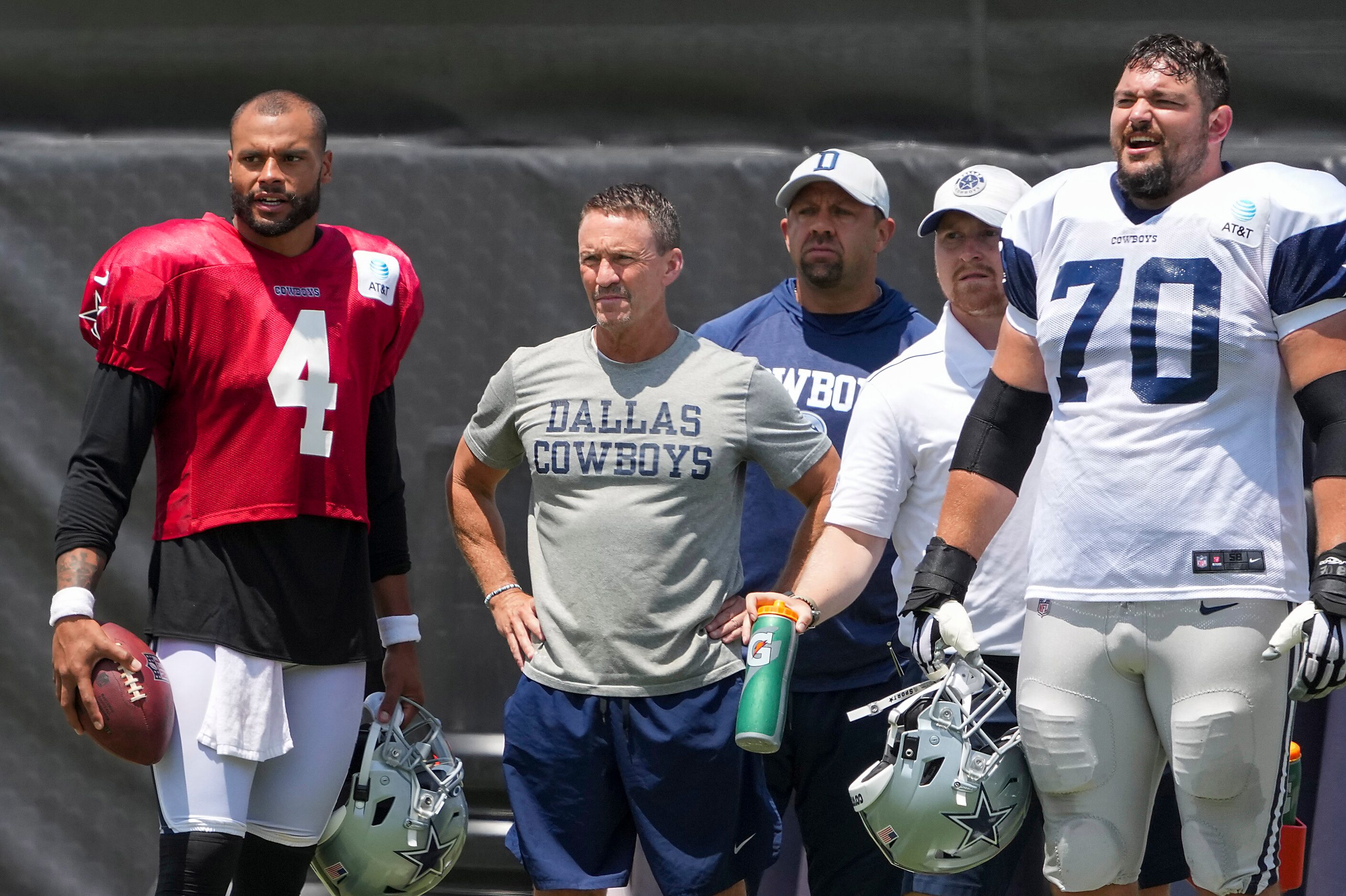 Dallas Cowboys quarterback Dak Prescott (4) watches the team run 11-on-11 drills from the...