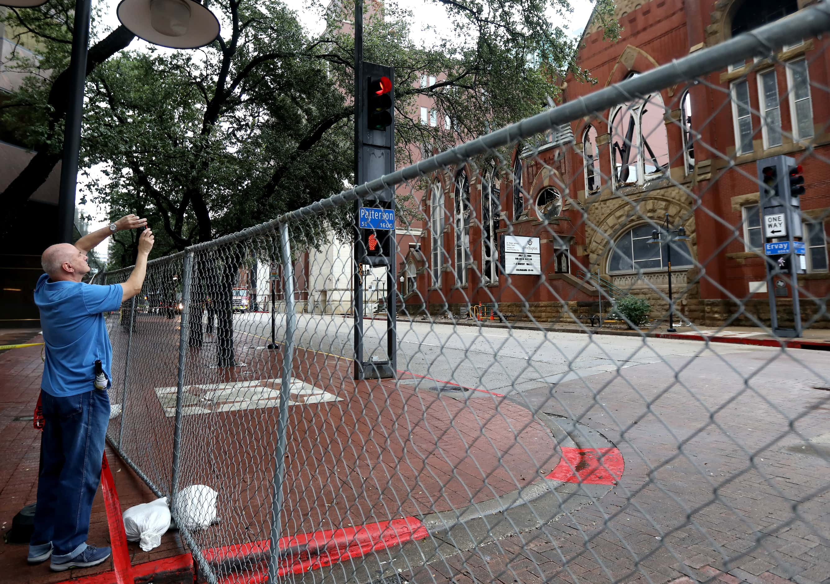 People gather at the site of a fire at First Baptist Dallas church, Sunday, July 21, 2024,...