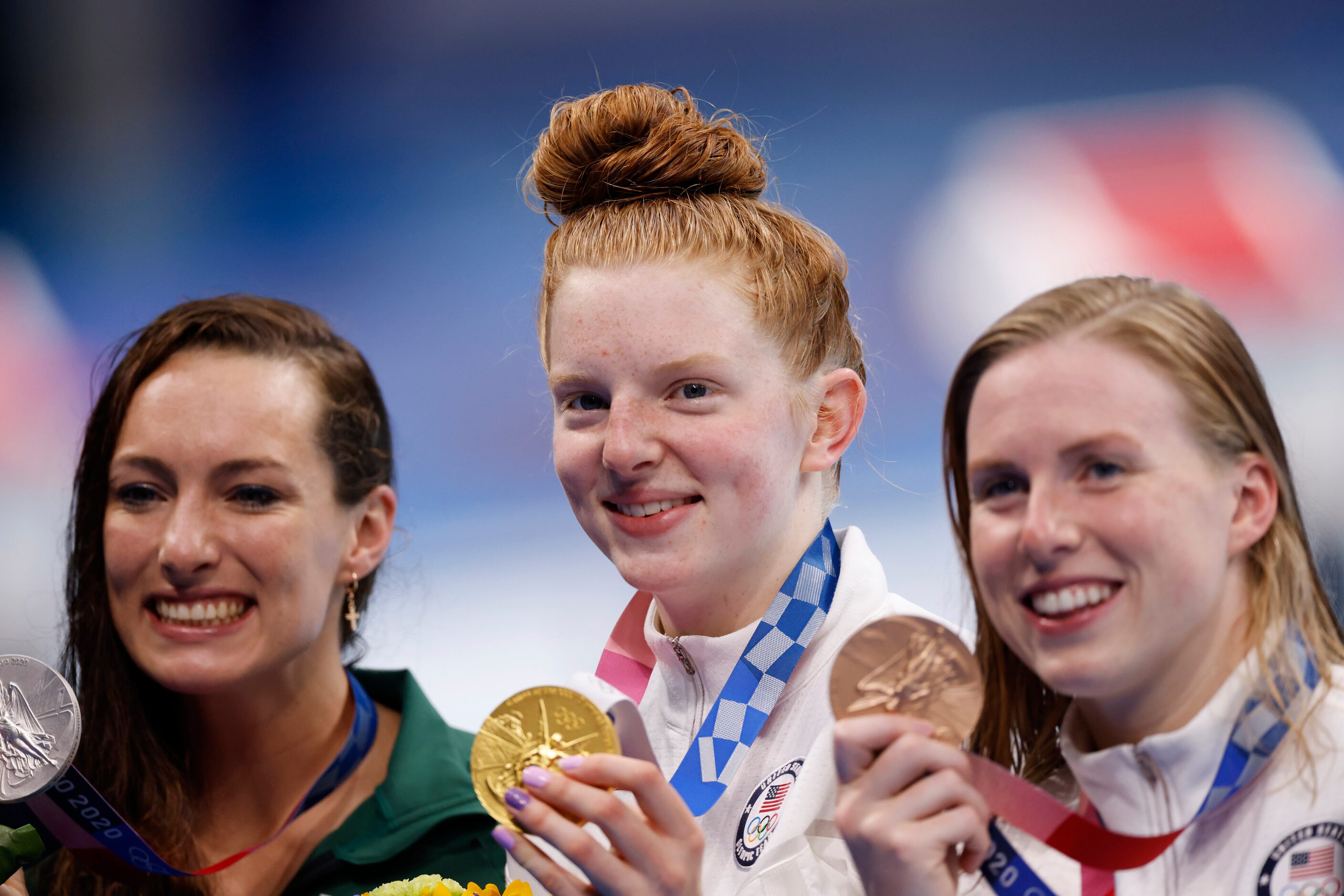 USA’s Lydia Jacoby (center), USA’s Lilly King (right) and South Africa’s Tatjana Schoenmaker...