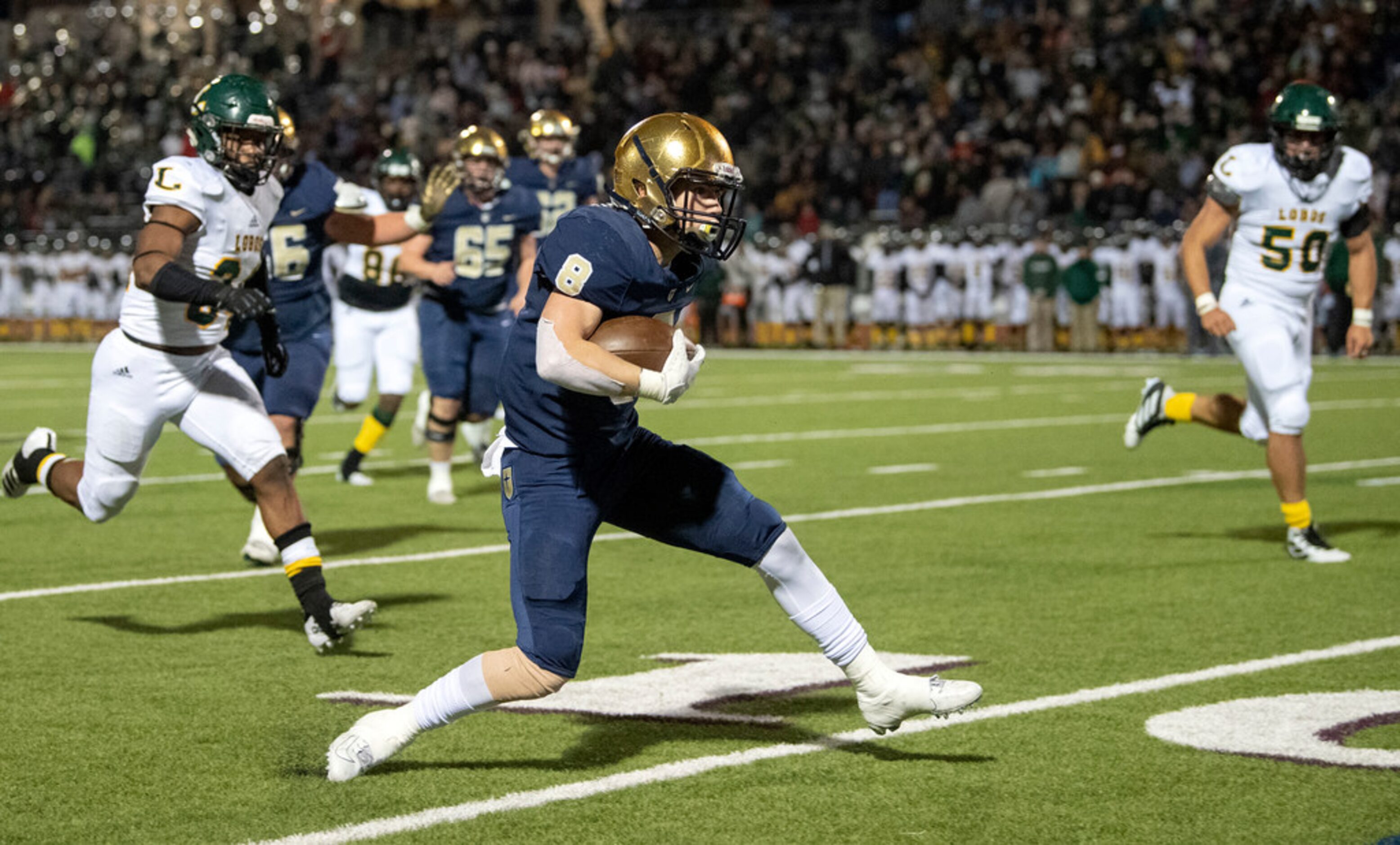 Jesuit junior running back Jake Taylor (8) turns upfield against Longview on a reception in...