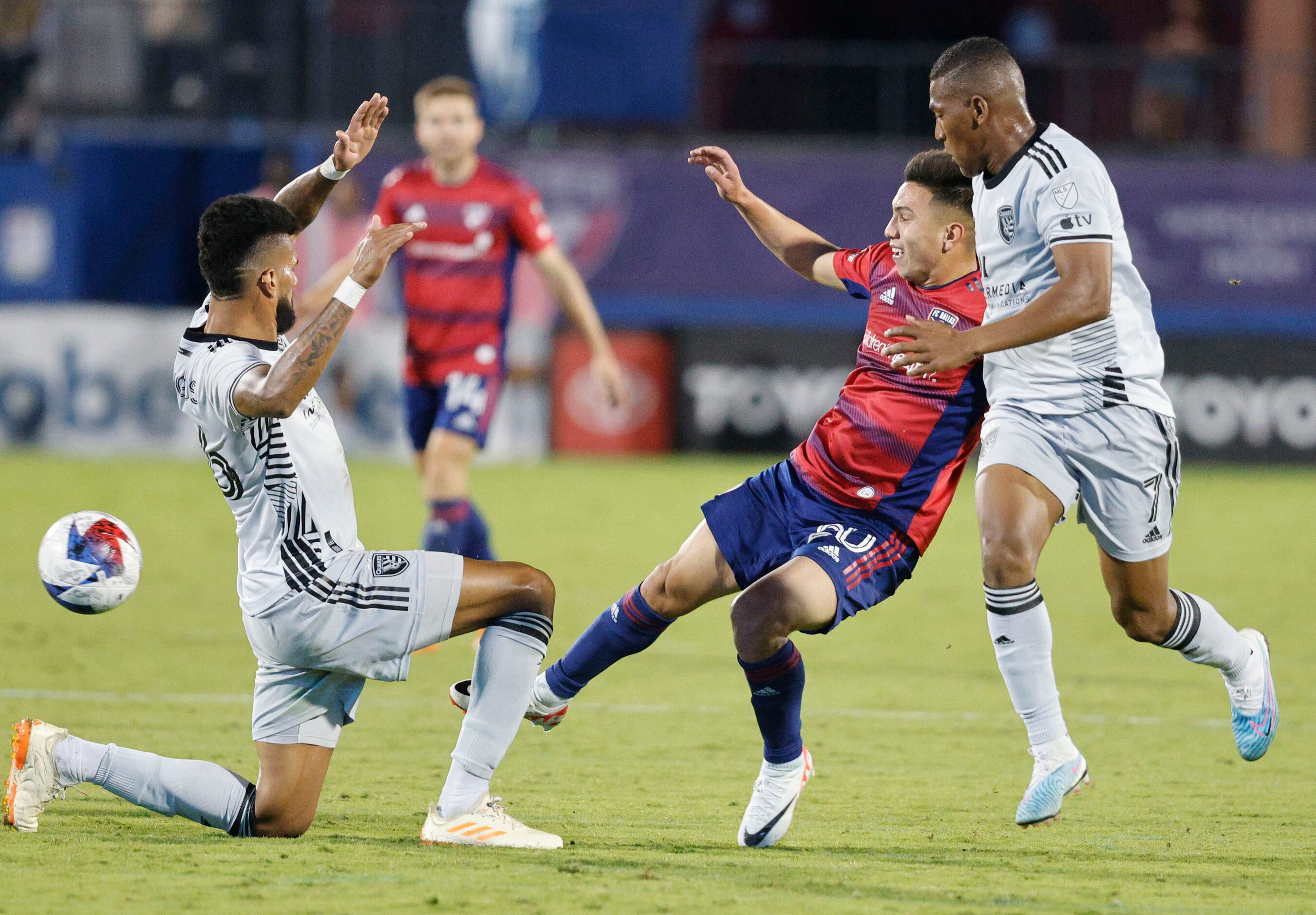 FC Dallas forward Alan Velasco (20) tries to pass against San Jose Earthquakes defender...