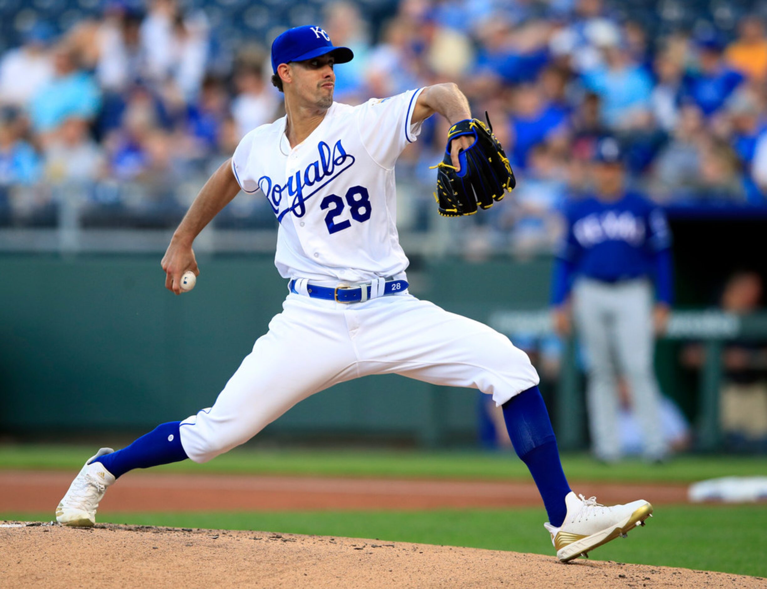 Kansas City Royals starting pitcher Jorge Lopez delivers to a Texas Rangers batter during...