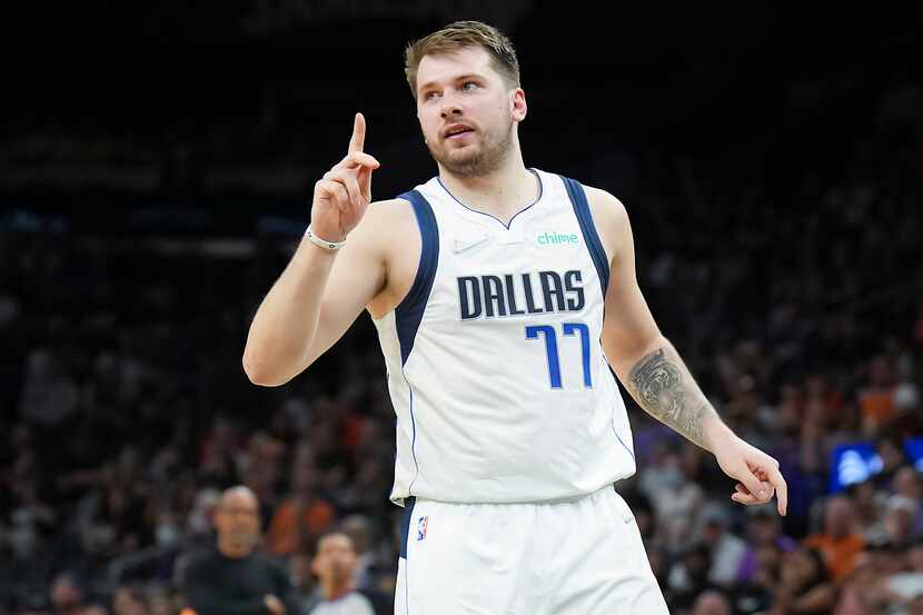 Dallas Mavericks guard Luka Doncic motions to a referee after scoring during the second...