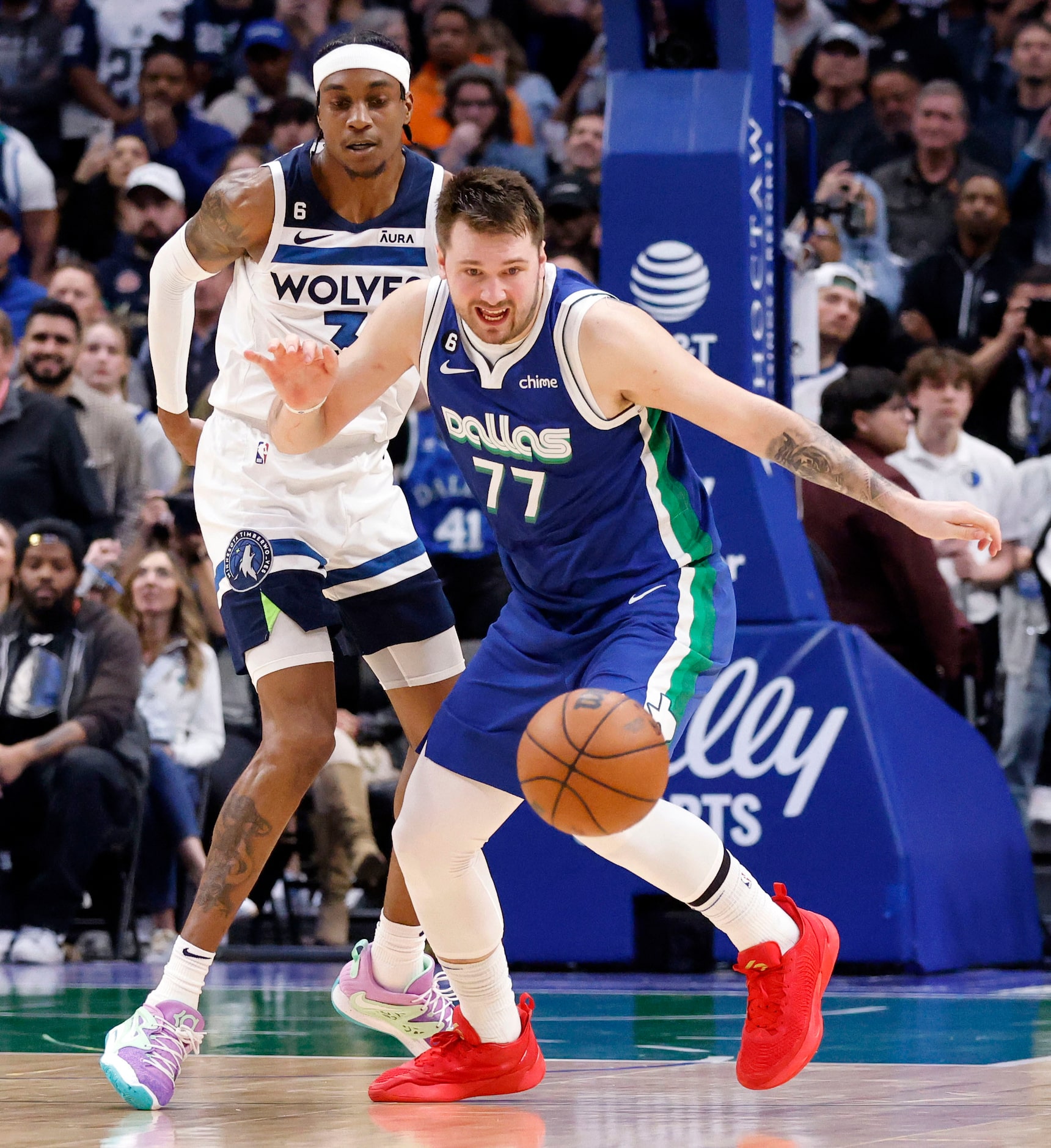 Dallas Mavericks guard Luka Doncic (77) chases down the ball after having it  knocked away...